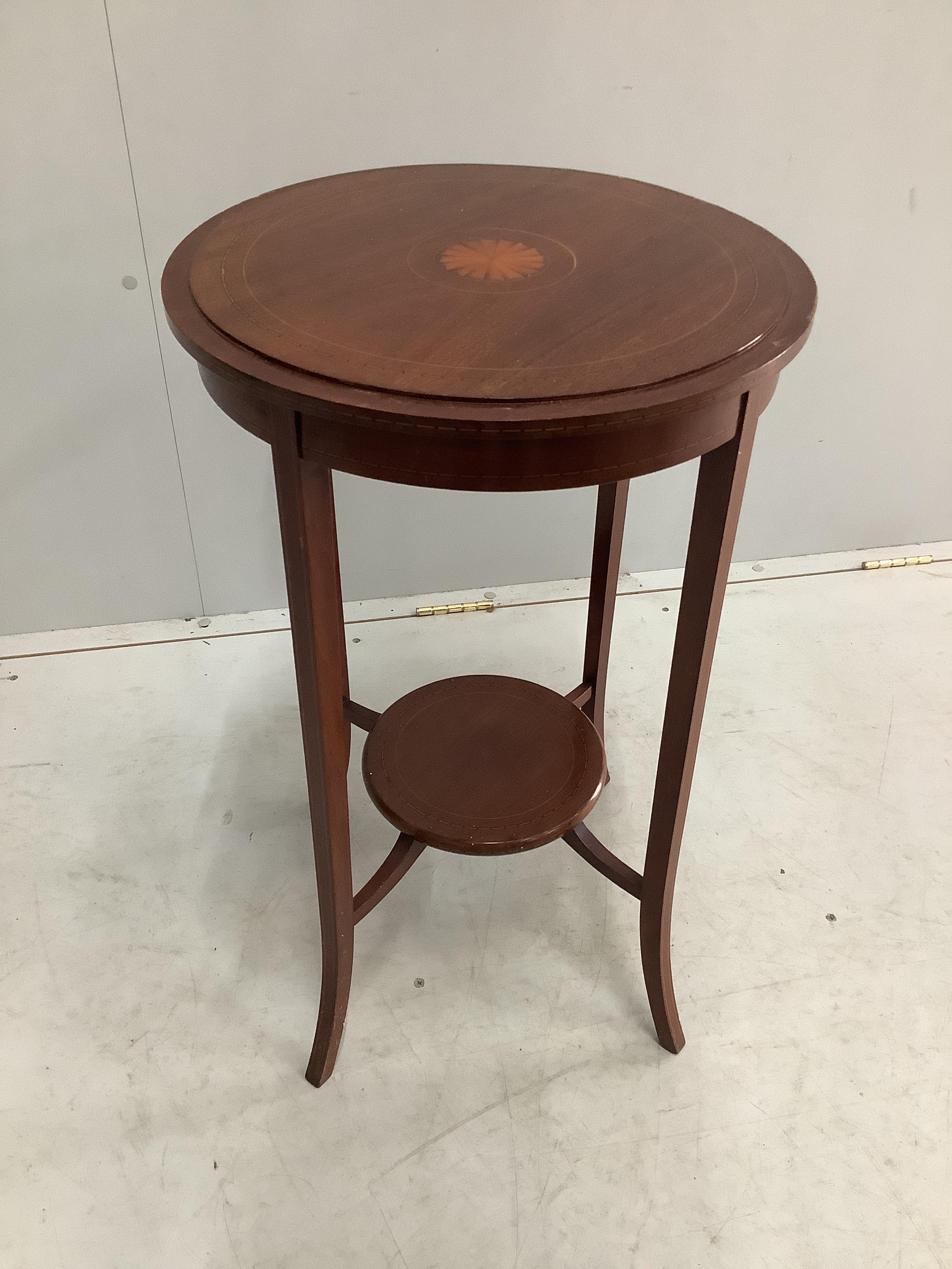 An Edwardian inlaid mahogany circular tray top occasional table, diameter 51cm, height 73cm